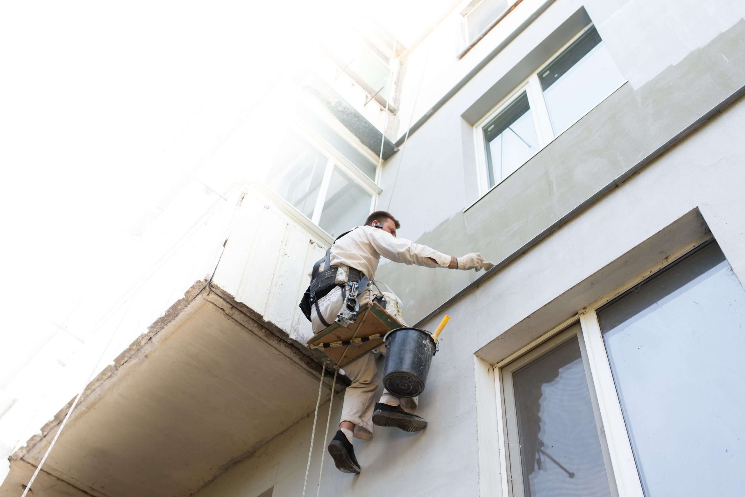 Builder,Climber,Repairs,The,Facade,Of,The,Building